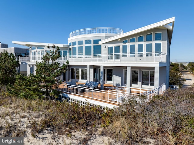 back of property featuring an outdoor living space