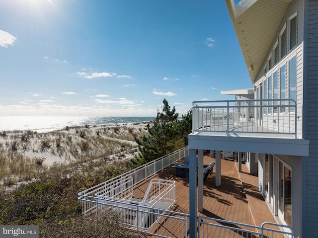 exterior space with a balcony and a water view