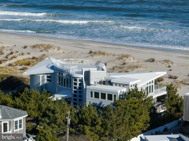 birds eye view of property featuring a water view and a view of the beach