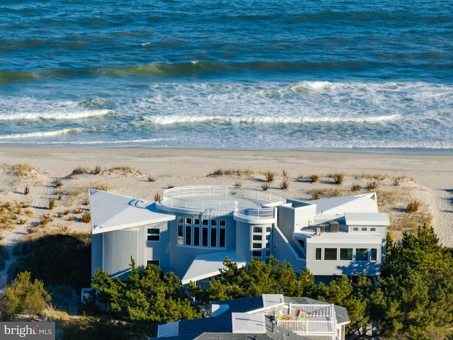 bird's eye view featuring a water view and a view of the beach