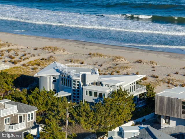 drone / aerial view featuring a view of the beach and a water view