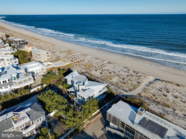 aerial view featuring a water view and a beach view