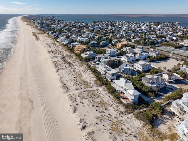 aerial view with a beach view and a water view