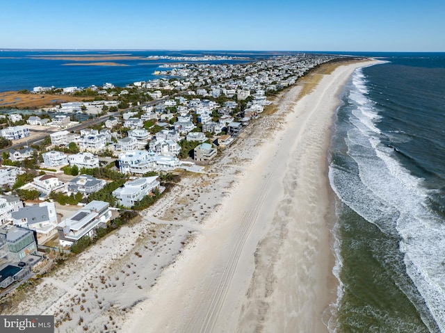 aerial view featuring a water view and a beach view