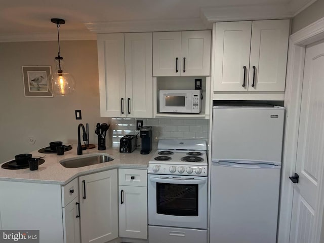 kitchen featuring white cabinets, white appliances, ornamental molding, and sink