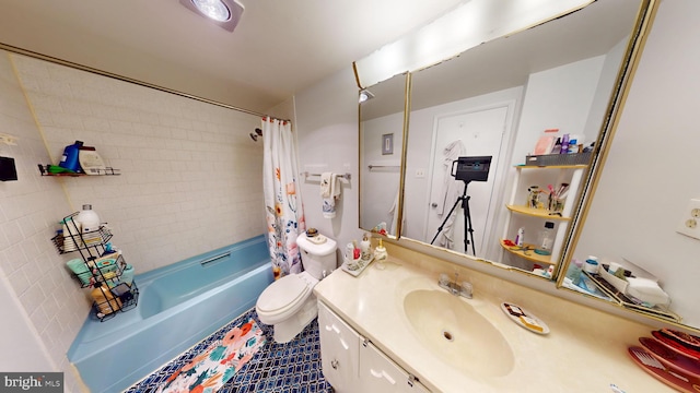 full bathroom with tile patterned flooring, shower / tub combo with curtain, vanity, and toilet