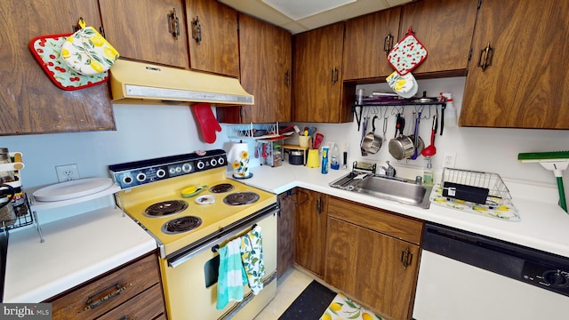 kitchen featuring white appliances and sink