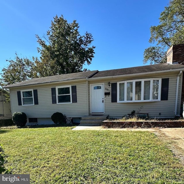 single story home with a front yard