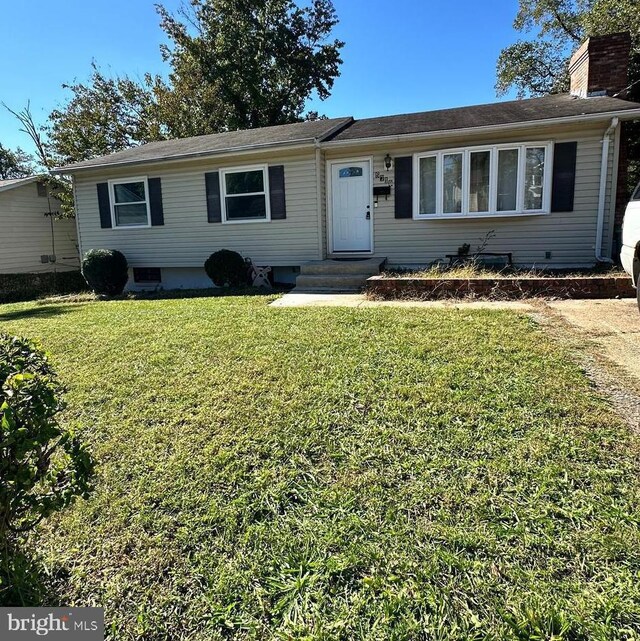 6710 Hastings Dr, Capitol Heights, MD 20743 - ranch-style house with a front lawn and a chimney