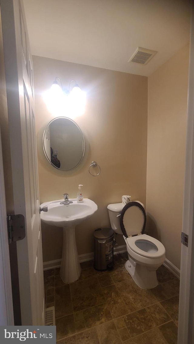 bathroom featuring toilet