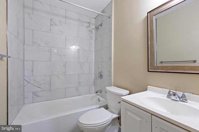 full bathroom with vanity, toilet, and tiled shower / bath