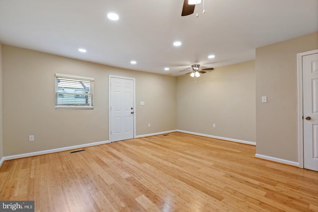 unfurnished room featuring ceiling fan and light wood-type flooring