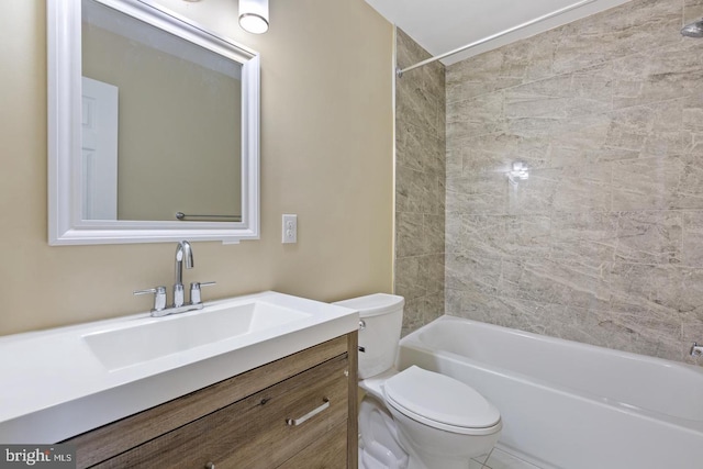 full bathroom with tiled shower / bath combo, toilet, and vanity