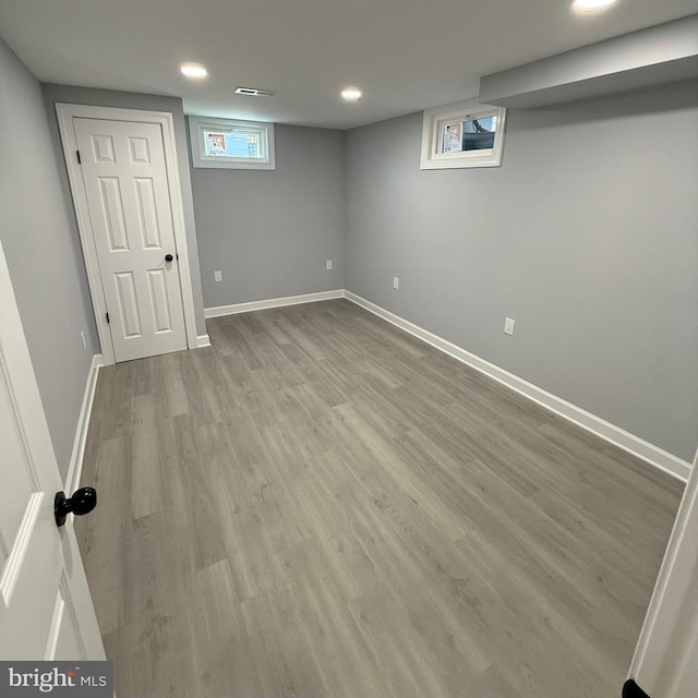 basement featuring light hardwood / wood-style floors