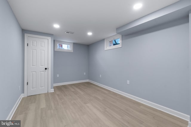 basement featuring light wood-type flooring