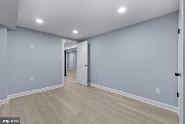 spare room with light wood-type flooring