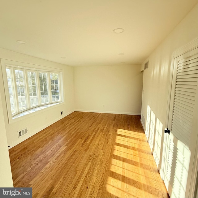 empty room with light wood-type flooring