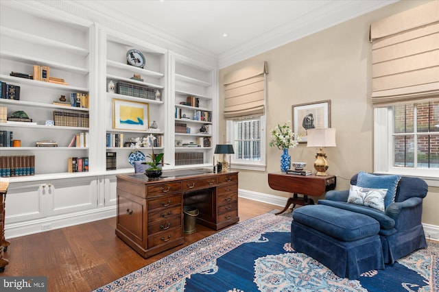 office area with built in shelves, hardwood / wood-style flooring, and crown molding