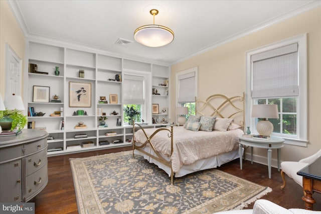 bedroom featuring dark hardwood / wood-style floors and crown molding