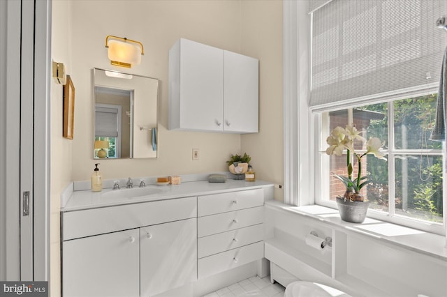 bathroom featuring tile patterned flooring and vanity