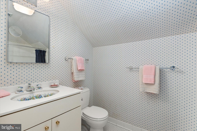 bathroom featuring tile patterned floors, vanity, and toilet