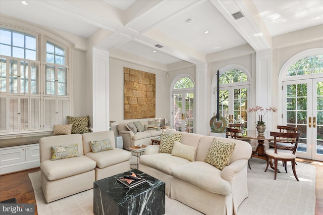 living room featuring french doors, light wood-type flooring, coffered ceiling, and beam ceiling