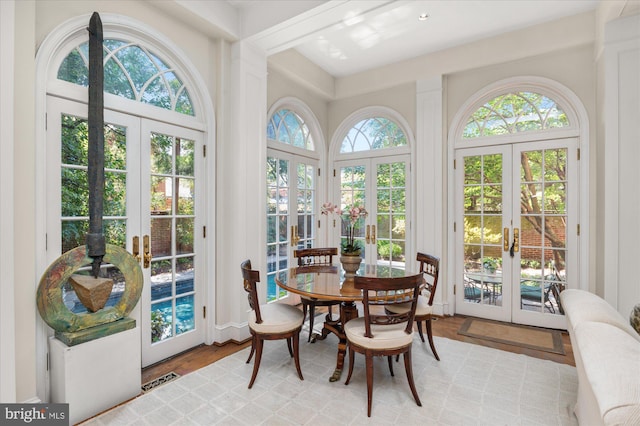 sunroom featuring french doors and a wealth of natural light