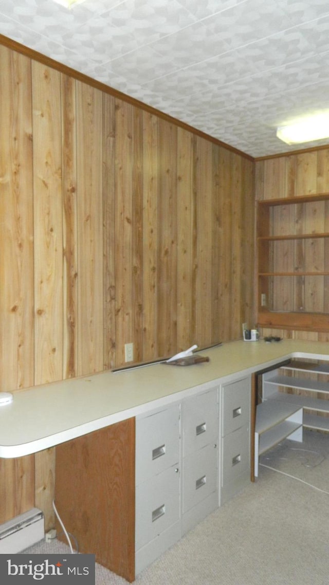 unfurnished office with a textured ceiling and wooden walls