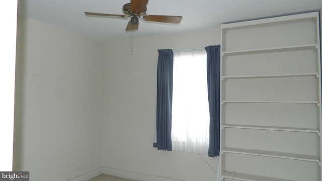 unfurnished room featuring ceiling fan