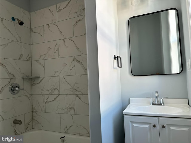 bathroom with vanity and tiled shower / bath combo