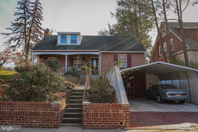 view of front of property featuring covered porch and a carport