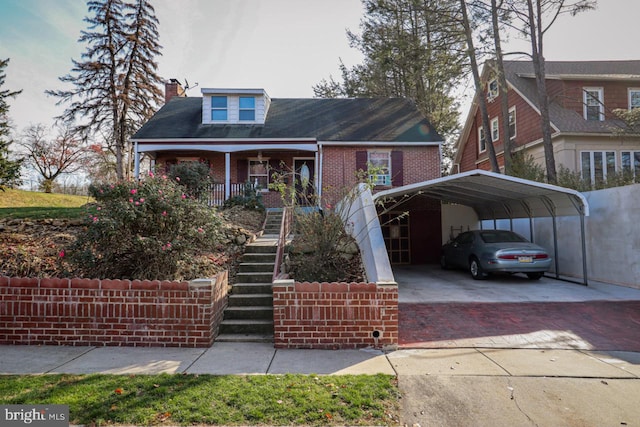 view of front of home with covered porch and a carport