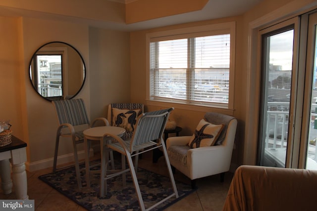 living area with tile patterned floors