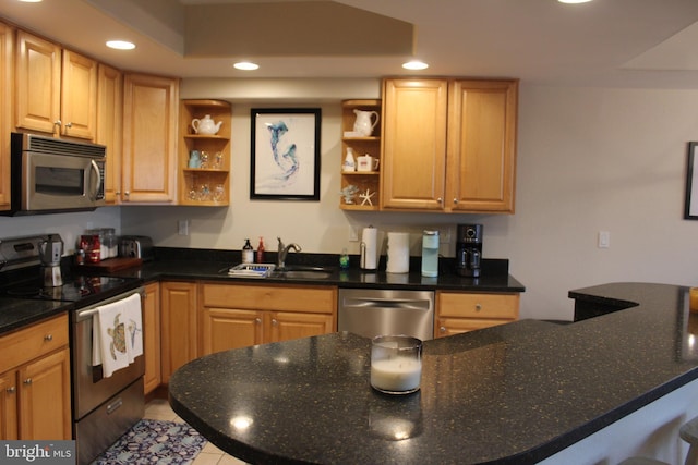 kitchen featuring appliances with stainless steel finishes, light tile patterned floors, and sink