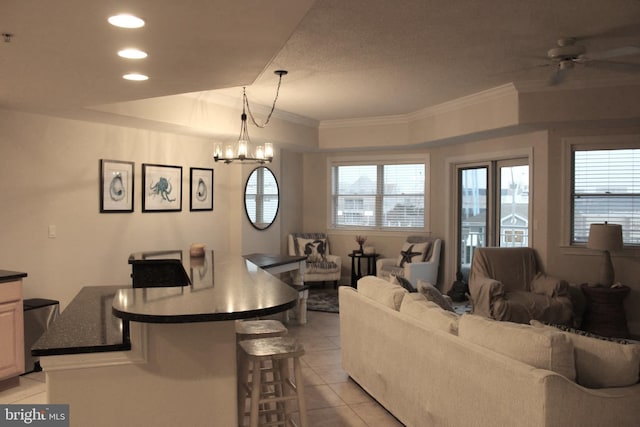 18 41st St Unit 304, Ocean City, MD 21842 - living room featuring a ceiling fan, light tile patterned flooring, crown molding, recessed lighting, and a chandelier