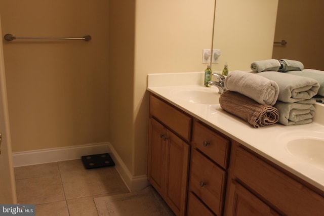 bathroom featuring tile patterned flooring and vanity