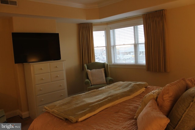 bedroom featuring crown molding