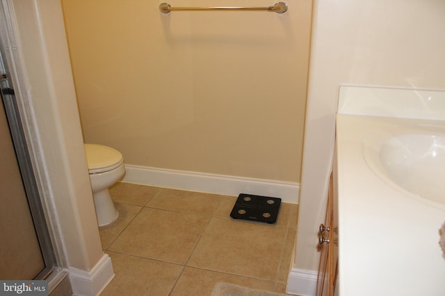 18 41st St Unit 304, Ocean City, MD 21842 - bathroom with tile patterned flooring, vanity, toilet, baseboards, and a shower with shower door