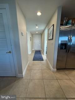 hallway featuring light tile patterned floors