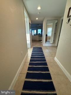 corridor with tile patterned flooring