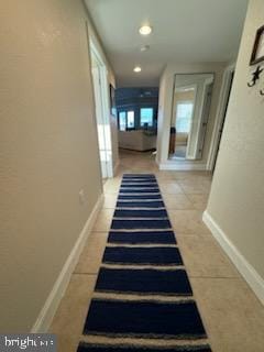 18 41st St Unit 304, Ocean City, MD 21842 - staircase with tile patterned floors and baseboards