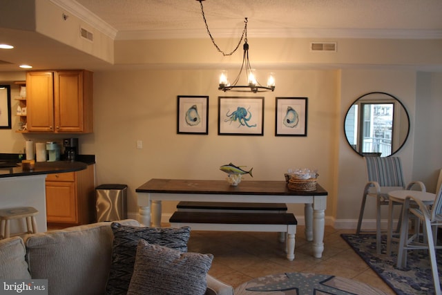 tiled dining space featuring crown molding, a chandelier, and a textured ceiling