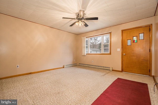 foyer with ceiling fan, a baseboard heating unit, and light colored carpet