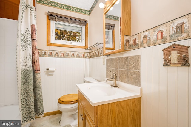 full bathroom with shower / tub combo, vanity, and toilet