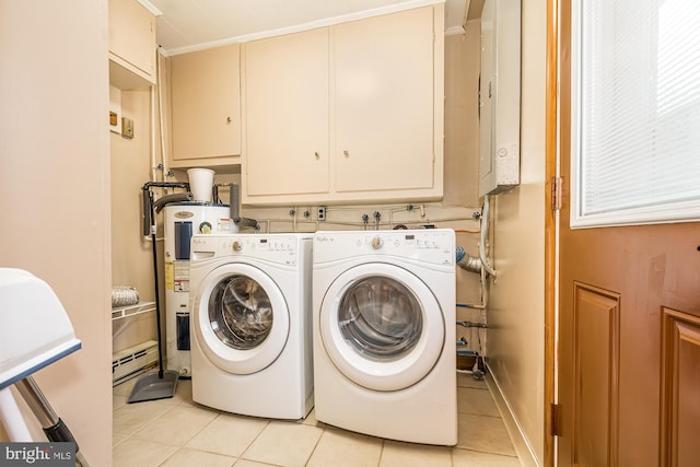 clothes washing area featuring washer and dryer, water heater, light tile patterned floors, crown molding, and cabinets