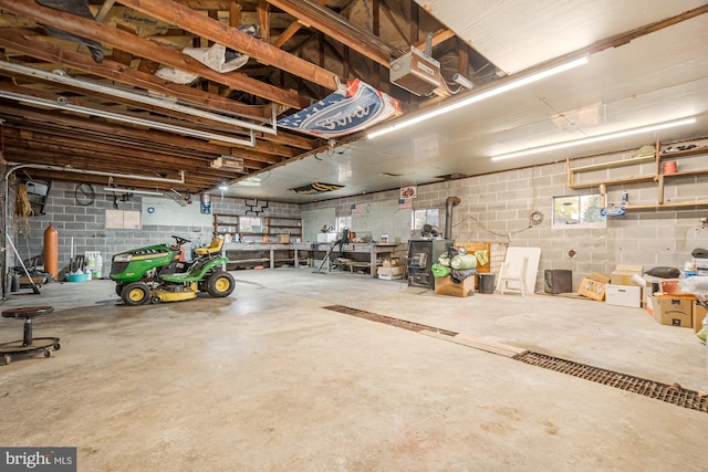 garage featuring a workshop area and a garage door opener