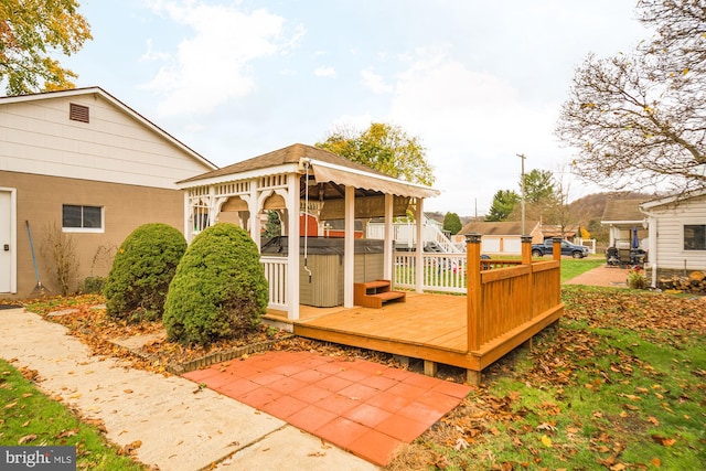 deck with a hot tub