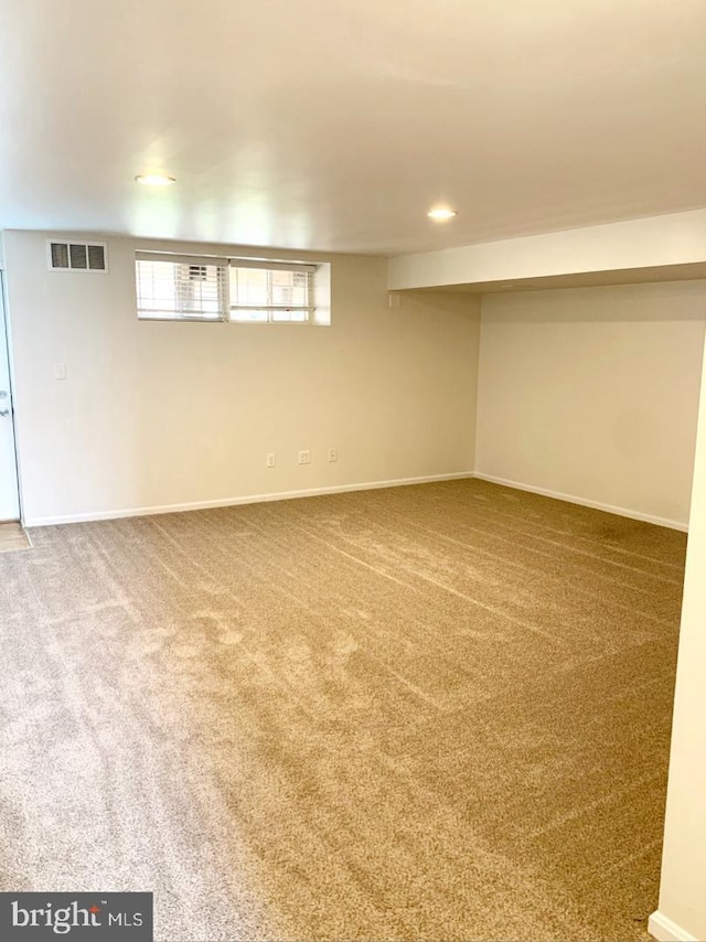 basement featuring carpet flooring