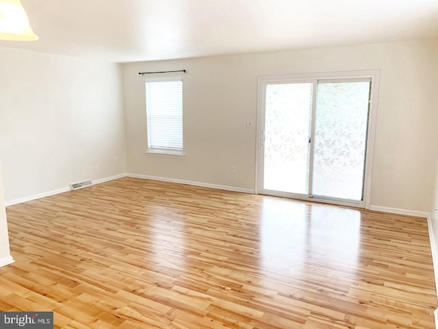 unfurnished room featuring light hardwood / wood-style floors