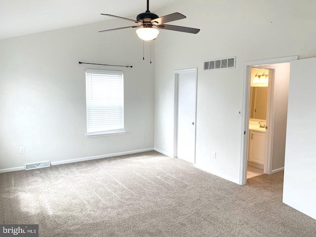 unfurnished bedroom featuring connected bathroom, ceiling fan, and carpet floors